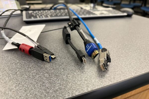 Pedestal - laptop cable connections with cables pulled out showing cable ends