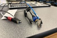 Pedestal - laptop cable connections with cables pulled out showing cable ends