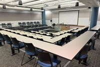 Front of room view with lectern center in front of markerboard