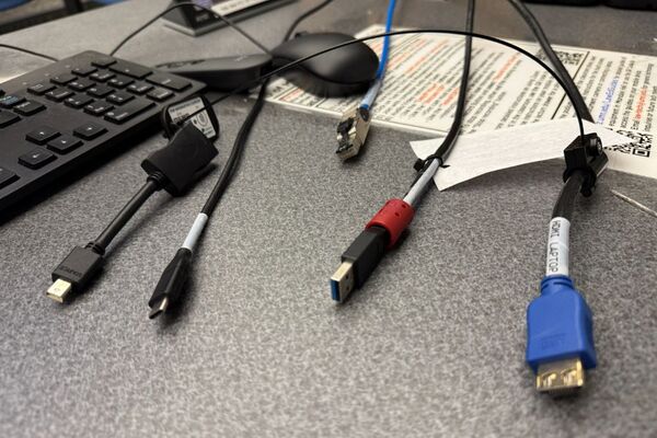 Pedestal - laptop cable connections with cables pulled out showing cable ends