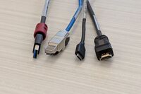 Pedestal - laptop cable connections with cables pulled out showing cable ends