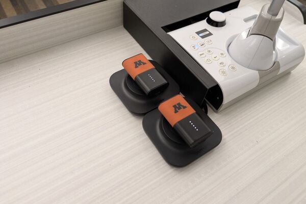 Pedestal - showing two wireless mics in charging base