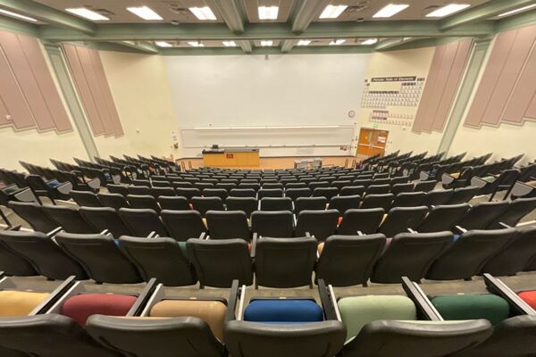 Front of room view with lectern and demonstration bench at left side of room