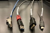 Pedestal - laptop cable connections with cables pulled out showing cable ends