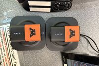 Microphones on top of instructor pedestal with charging base