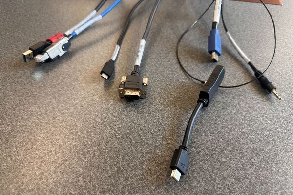 Pedestal - laptop cable connections with cables pulled out showing cable ends