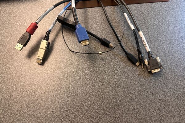 Pedestal - laptop cable connections with cables pulled out showing cable ends