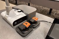 Microphones on top of instructor pedestal with charging base