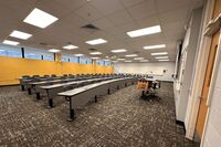 Back of room view of student fixed-table and chairs seating 