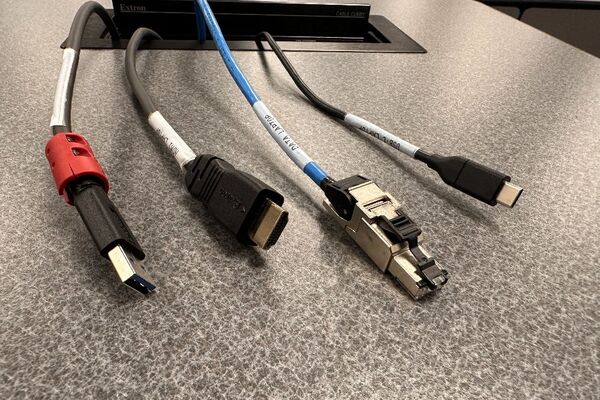 Pedestal - laptop cable connections with cables pulled out showing cable ends