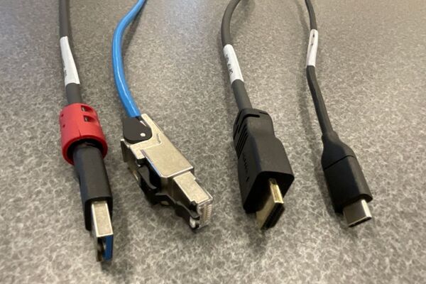 Pedestal - laptop cable connections with cables pulled out showing cable ends