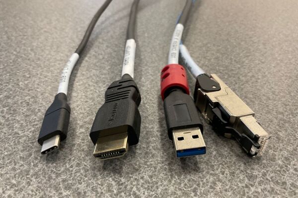 Pedestal - laptop cable connections with cables pulled out showing cable ends