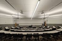 Front of room view with lectern center in front of markerboard 