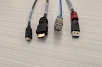 Pedestal - laptop cable connections with cables pulled out showing cable ends