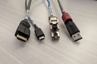 Pedestal - laptop cable connections with cables pulled out showing cable ends