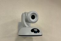 Camera mounted to a wall and instructor enabled adjustments to the lens to allow the instructor to be "seen" by the camera in more locations around the room