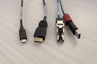 Pedestal - laptop cable connections with cables pulled out showing cable ends