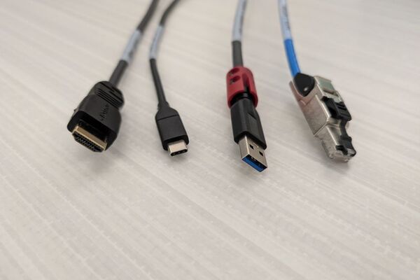 Pedestal - laptop cable connections with cables pulled out showing cable ends