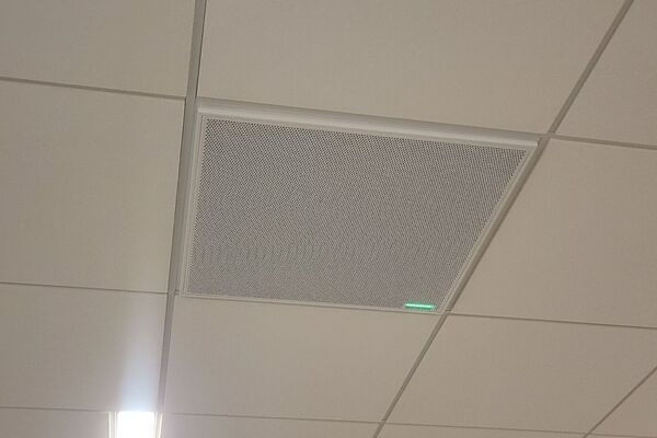 microphone tile-mounted in the ceiling to provide microphone coverage over student seating