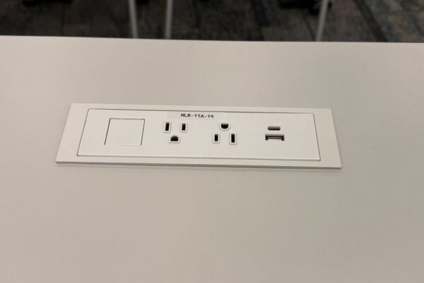 Student desk with built in power outlet	
