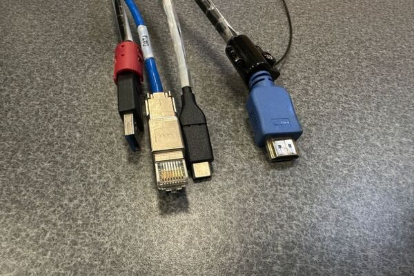 Pedestal - laptop cable connections with cables pulled out showing cable ends
