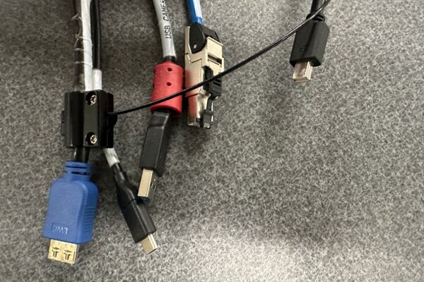 Pedestal - laptop cable connections with cables pulled out showing cable ends