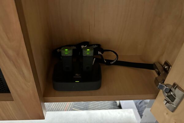 Pedestal - inside view showing two wireless mics in charging base