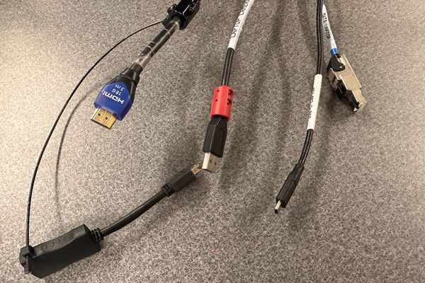 Pedestal - laptop cable connections with cables pulled out showing cable ends
