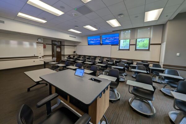 Back of room view of student tablet arm seating and markerboard at rear of room