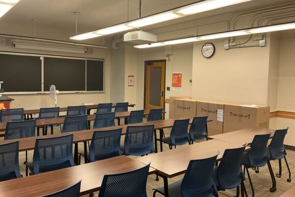 Front of room view with lectern on left in front of chalkboard
