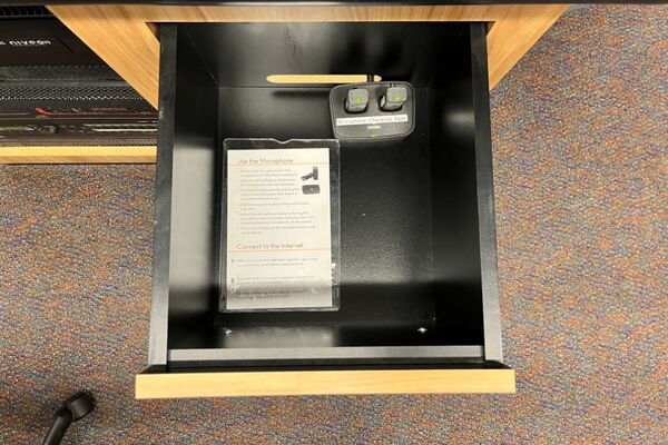  Pedestal - inside view of drawer showing two wireless mics in charging base 