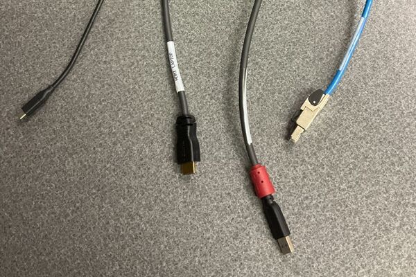 Pedestal - laptop cable connections with cables pulled out showing cable ends