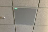 White 2’ x 2’ tile mounted in the ceiling to provide microphone coverage over student seating