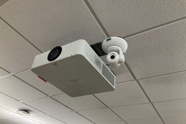 Camera mounted to ceiling and instructor enabled adjustments to the lens to allow the instructor to be "seen" by the camera in more locations around the room
