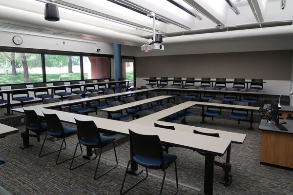 Back of room view of student fixed-table and chair seating