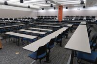 Back of room view of student fixed table and chair seating