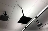 A 2’ x 2’ tile mounted to the ceiling to provide microphone coverage over student seating