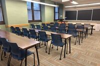 Front of room view with lectern on left in front of chalkboard