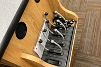 Pedestal - view of drawer showing assistive listening devices in charging base