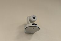 Camera mounted to a wall and instructor enabled adjustments to the lens to allow the instructor to be "seen" by the camera in more locations around the room