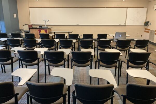 Front of room view with lectern on left in front of markerboard 