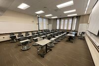 Back of room view of student tablet arm seating 