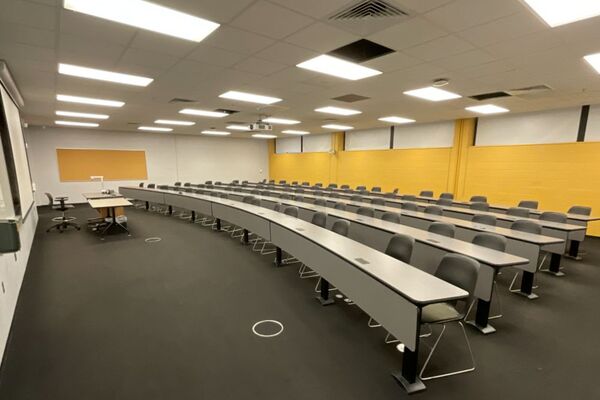 Back of room view of student fixed-table and chairs seating 