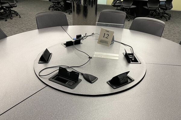 Group seating with connections for student provided laptops and push-to-talk microphone.