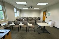 Rear of room view of student tablet arm chair seating