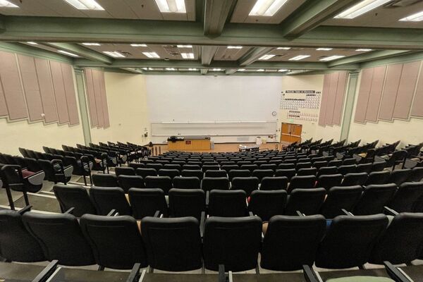 Front of room view with lectern and demonstration bench at left side of room