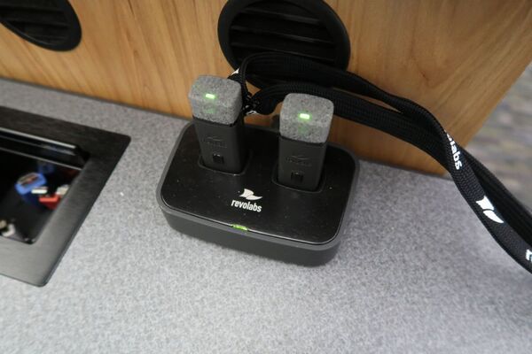 View of two wireless mics in charging base