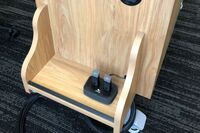Pedestal - view of drawer showing two wireless mics in charging base