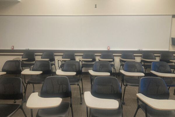 Back of room view with markerboard, and tablet arm seating