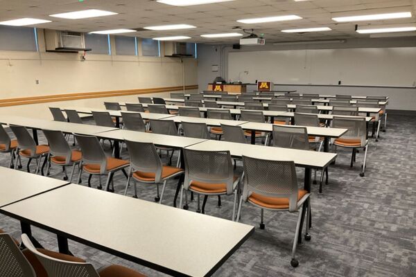 Front of room view with lectern on left in front of markerboard 